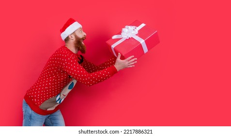 Surprised Man With Christmas Gift. Merry Christmas. Santa Man Hurry Up With Christmas Gift