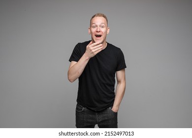 Surprised Man Coving Mouth With Hand.