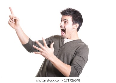 Surprised Man Looking And Pointing Up Isolated On A White Background