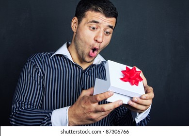 Surprised  Man Opening Big Gift Box