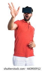 Surprised man using VR glasses