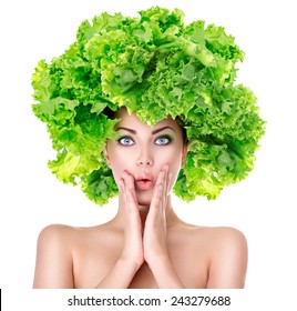 Surprised model girl with Lettuce hair style. Beautiful happy young woman with green vegetables on her head. Healthy food concept, diet, vegetarian food. Dieting concept. Weight loss. Vegan food