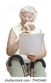 Surprised Senior Reading Letter