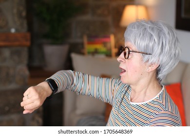 Surprised Senior Woman Looking At Watch