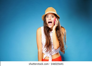 Surprised Shocked Summer Girl Talking On Mobile Phone, Blue Background