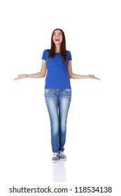 Surprised Teen Girl With Outstretched Arms Looking Up On Copy Space. Isolated On White.