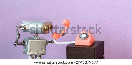 Surprised tiny silver robot operator speaking into retro pink rotary phone receiver. Lilac background. Vintage telecom concept, phone service flyer