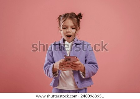 Similar – Image, Stock Photo Girl looking a smartphone on a wooden deck.