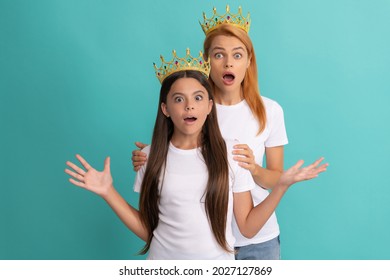 Surprised Wide-eyed Selfish Woman And Girl Child Wear Crowns Blue Background, Shock