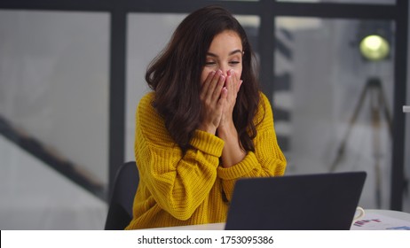 Surprised Woman Looking Computer Screen Indoor. Excited Girl Chatting On Laptop Computer In Slow Motion. Close Up Happy Businesswoman Closing Face In Front Of Notebook In Home Office.