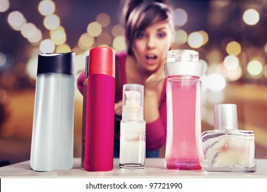 Surprised woman looking at perfumes