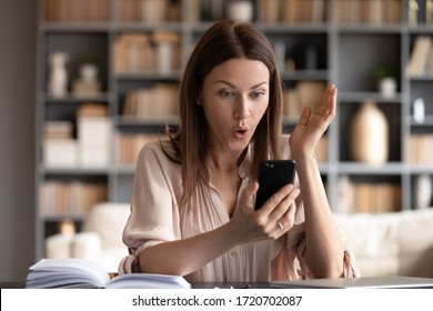 Surprised woman with open mouth looking at phone screen, reading unexpected message, shocked young female received unbelievable news, getting job promotion, online lottery win, success