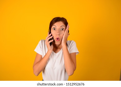 surprised woman talking on the phone - Shutterstock ID 1512952676