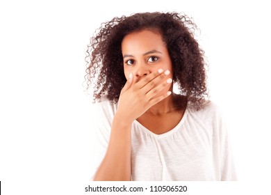 Surprised Young African Woman With Hands Over Her Mouth