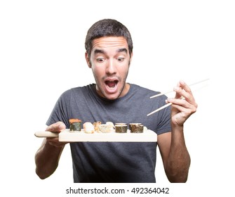 Surprised Young Man Eating Sushi