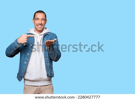 Similar – Image, Stock Photo young man holding his fiance’s hand with gold ring while making a marriage proposal with bouquet of red roses. Engagement of a young couple in love. The concept of love and togetherness.