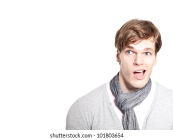surprised young man looking at copyspace - isolated on a white background
