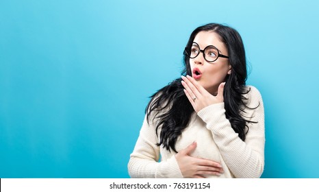 Surprised Young Woman Posing On A Solid Background