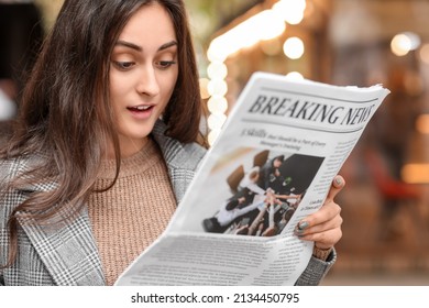 Surprised Young Woman Reading Newspaper On Street, Closeup