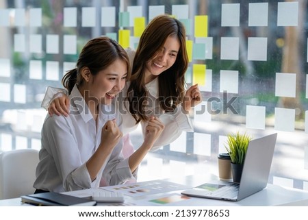 A surprised young woman receives an email message with a cash prize on a smartphone device. The man was very happy and excited. That has been very profitable, like winning the lottery