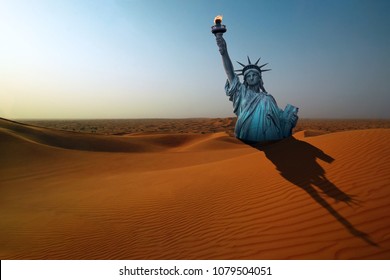 Surreal Apocalyptic Desert Landscape With The Statue Of Liberty Making Long Shadow On The Dunes