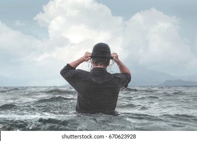 Surreal Businessman Wearing Wet Hat