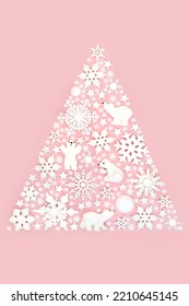 Surreal Christmas Tree Shape Decoration North Pole Concept With Snowflake, Polar Bear And Star Decorations On Pastel Pink Background. Festive  Fun Magical Design For The Holiday Season.