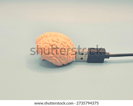 Surreal concept of a human brain connected to a USB cable, symbolizing artificial intelligence, brain-computer interface, and digital cognition.  