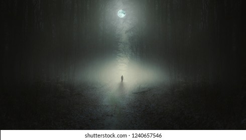 Surreal horror scene with alone strange man in dark night forest. Dreamy landscape.