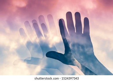 Surreal Image Of Blurred Motion Hand Silhouette On Purple Color Gradient Cloudy Sky,concept Of Confusion,blurry Sight,day Dream