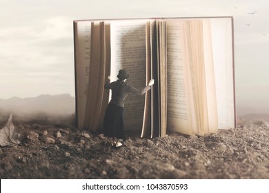 surreal image of a curious woman leafing through a giant book - Shutterstock ID 1043870593