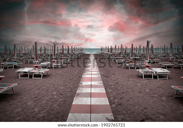 Surreal
landscape of deserted beach with
umbrellas