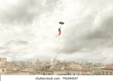 Surreal moment of a woman flying with her umbrella over the city