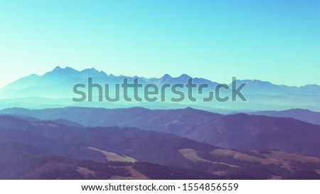 Surreal mountain landscape, turquoise gree mountains and sky, creative inspiration nature concept