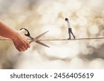 surreal person walks on a wire threatened by a hand with scissors that wants to cut it, abstract concept