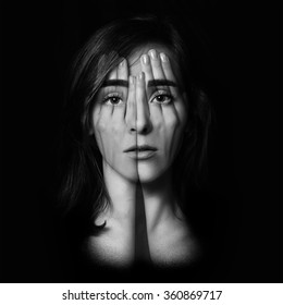 Surreal Portrait Of A Young Girl Covering  Her Face And Eyes With  Her Hands.Double Exposure. Black And White.