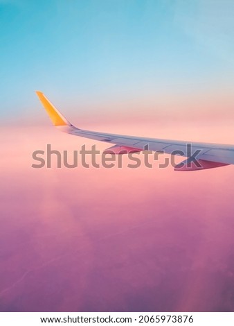 Surreal purple view from an airplane window, fantastic dream vacation flight, concept