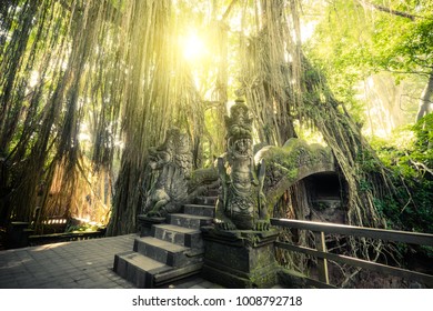 Surreal sunrise colors of fantasy Monkey Forest with Barong Lion bridge and Hindu Temple. Bali, Indonesia. Concept landscape for mysterious background