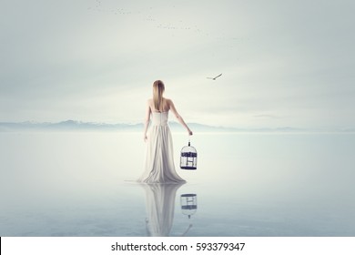 Surreal Woman Release A Bird Out From A Bird Cage