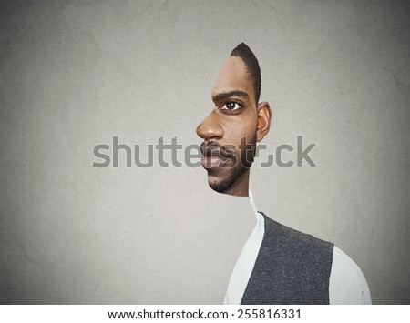 surrealistic portrait front with cut out profile of a young man isolated on grey wall background 