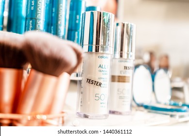 Surrey, BC / Canada - 06/11/19:  Colorscience Tester Products By Clarion, On Retail Display, On A Bright Makeup Counter. Mineral Makeup And Bronze Makeup Brushes, With Selective Focus.