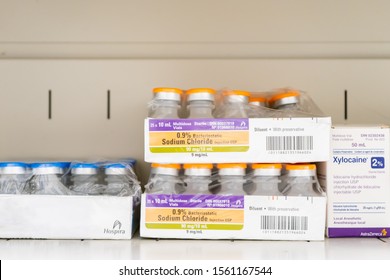 Surrey, BC / Canada - 06/11/19:  Sterile Bacteriostatic Sodium Chloride Vials For Injections In Box And Packaging, In A Doctor’s Medical Supply Closet. Next To Xylocaine Lidocaine Hydrochloride.