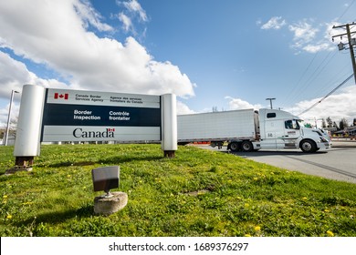 Surrey, Canada - Mar 29, 2020: Freight Truck Exiting Canadian Border Services Pacific Truck Crossing Location During Coronavirus Covid-19 Pandemic