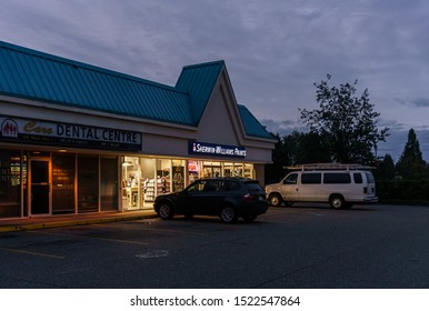 SURREY, CANADA - SEPTEMBER 23, 2019: Group Of Strip Mall Stores With Cars In Front.