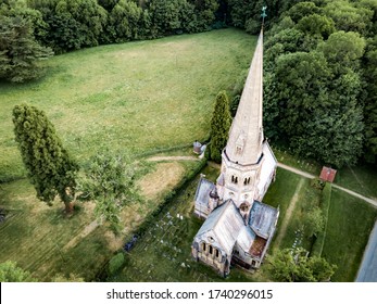 SURREY, UK- MAY, 2020: Aerial view of English church in the Surrey Hills 