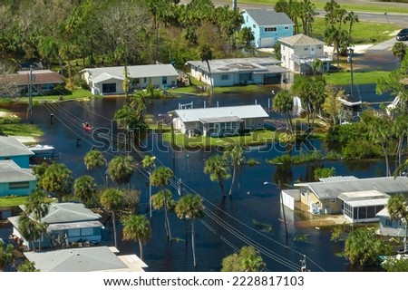 Surrounded by hurricane Ian rainfall flood waters homes in Florida residential area. Consequences of natural disaster