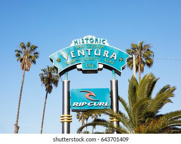Surrounded by palm trees, and inviting visitors to "Shop, Surf, Stay, Eat", this famous sign really captures the spirit of Ventura, California. This image was taken on May 11, 2017 at 5:44pm. 