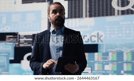Surrounded by virtual graphs and forecasting models, chief executive officer uses financial data and insight to drive business growth. Ensuring performance and smart decision making. Camera A.