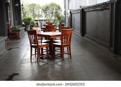 Surrounding the table are chairs, each one a testament to comfort and style. Upholstered in plush fabrics or crafted from polished wood, they beckon guests to linger a little longer, to savor the flav