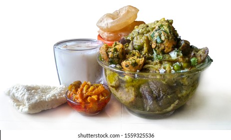 Surti Undhiyu,Famous Winter Special Gujarati Mix Veg. Sabzi Served With Puri,papad,pickle Nad Butter Milk.